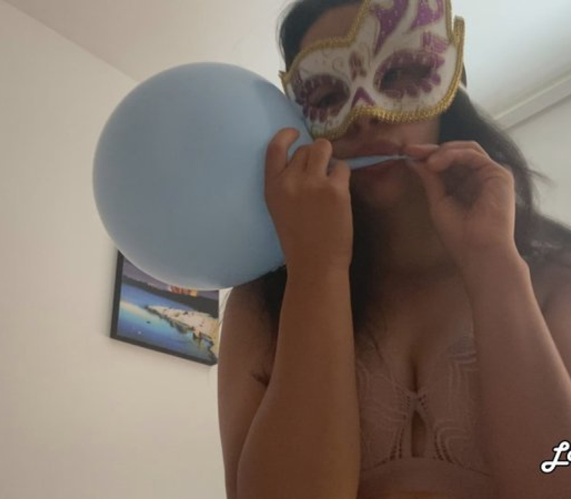 Sarah Sucking Air from the Balloons
