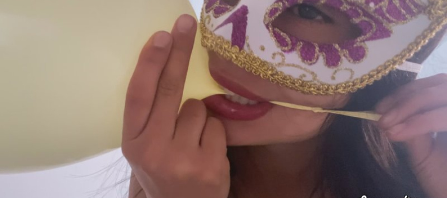 Sarah Sucking Air from the Balloons